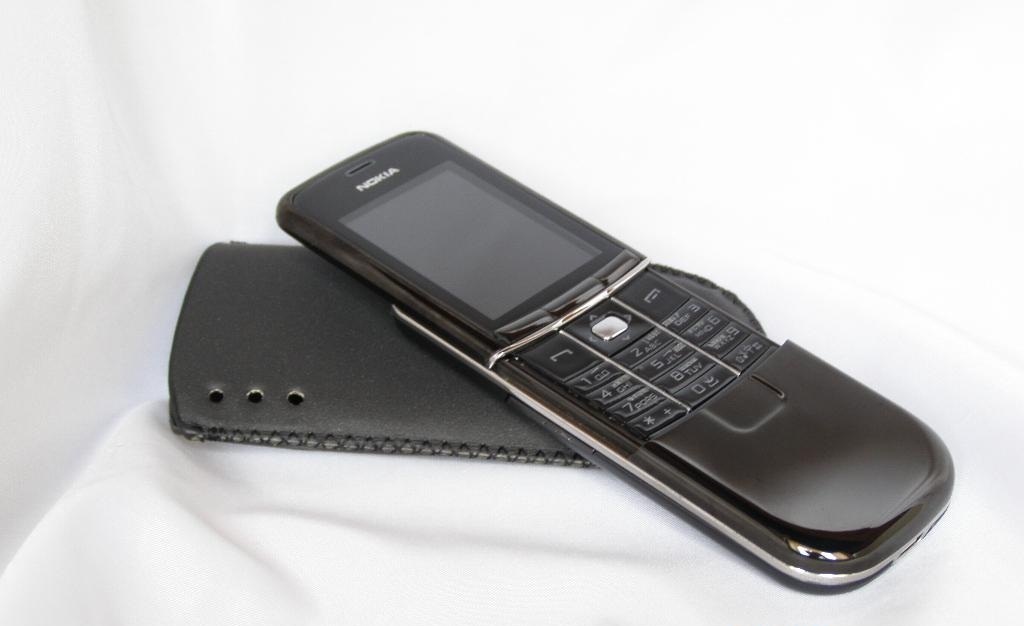 Телефон нокиа слайдер. Nokia 8900e. Нокиа слайдер 8900. Нокия слайдер металлический 8900. Нокиа слайдер в металлическом корпусе 8900.